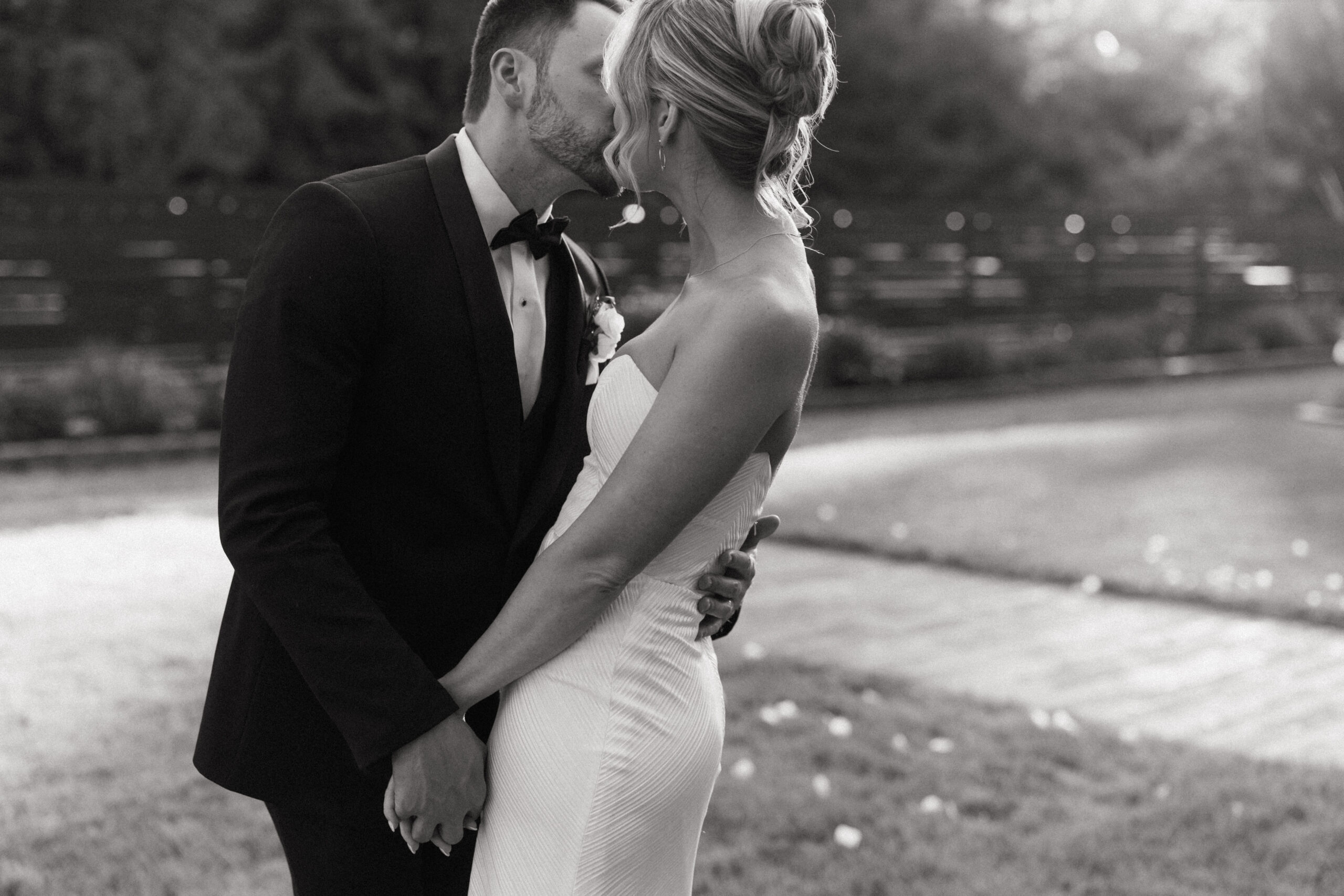 Hayley and Anderson taking an intimate kiss photo during sunset.